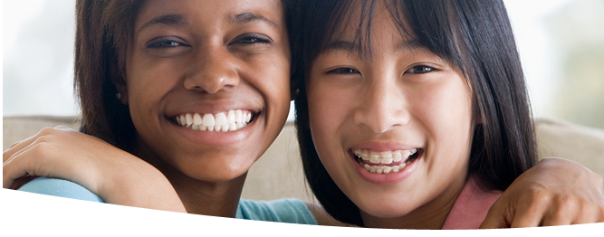 Two Young Woman Smiling